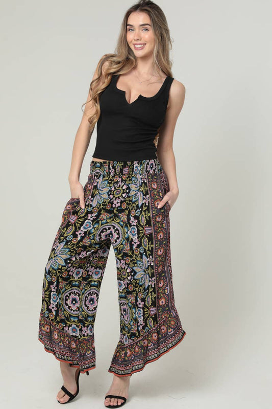 ANGLED HEM SMOCKED WAIST PRINTED WIDE LEG PANTS